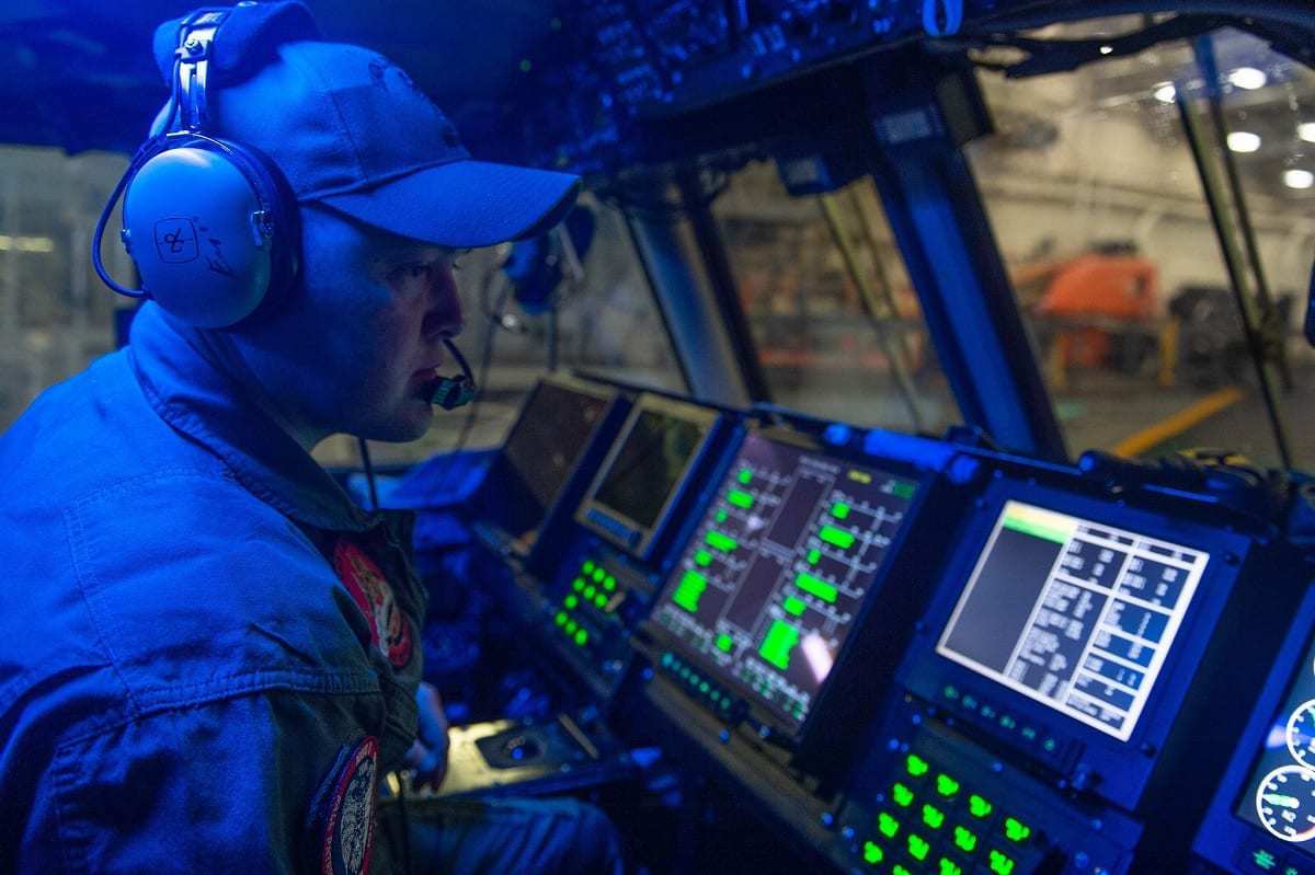 A Sailor works on an LCAC aboard USS Green Bay (LPD 20).