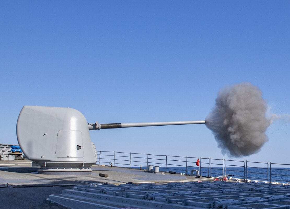 USS Normandy (CG 60) fires its forward Mark 45 mod 4 5-inch gun during a live-fire exercise.