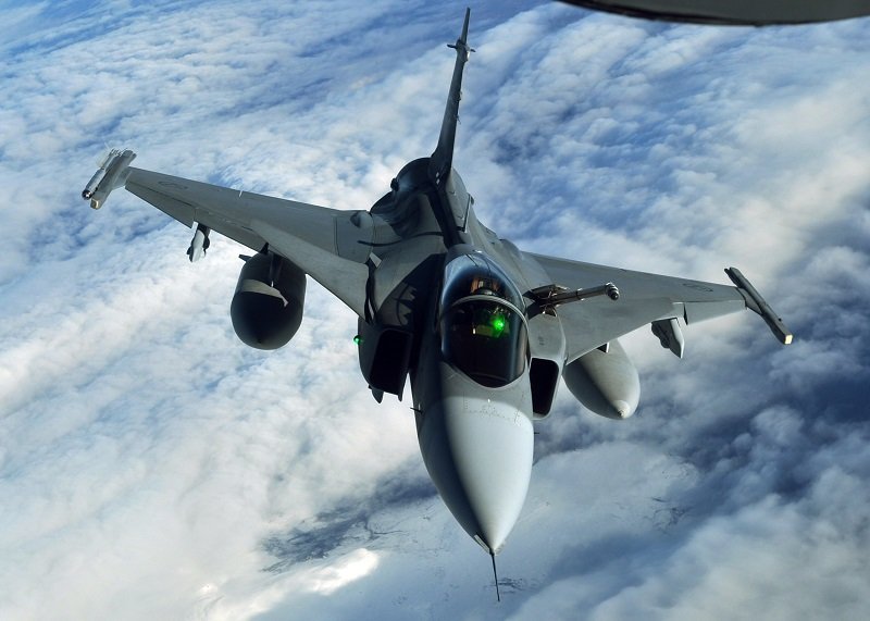 A Swedish JAS-39 Gripen returns to the play areas of the Arctic Challenge exercise Sept. 24, 2013, over Norway, after taking on fuel from a U.S. Air Force KC-135R Stratotanker. The JAS-39, in coordination with aircraft from other nations, formed a Blue assault force, which had to bypass or neutralize an opposing Red force attempting to stop them from an overall objective outlined in the day's scenario. (U.S. Air Force photo by 1st Lt. Christopher Mesnard/Released)