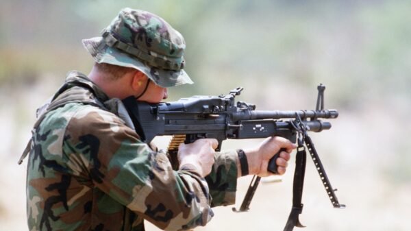 A Sea-Air-Land (SEAL) team member fires an M60 lightweight machine gun from the shoulder during a field training exercise. Image: Creative Commons.