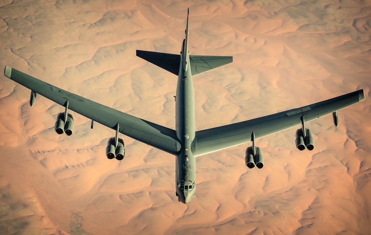 A U.S. Air Force B-52 Stratofortress assigned to the 2nd Bomb Wing departs after receiving fuel from a KC-135 Stratotanker, assigned to the 340th Expeditionary Air Refueling Squadron, during a multi-day Bomber Task Force mission over Southwest Asia, Dec. 10th, 2020. The B-52 is a long-range bomber with a range of approximately 8,800 miles, enabling rapid support of BTF missions or deployments and reinforcing global security and stability. (U.S Air Force photo by Staff Sgt. Trevor T. McBride)