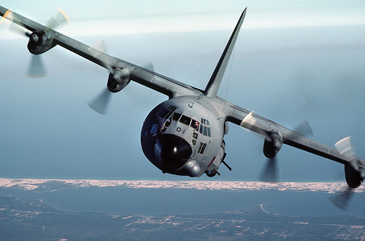 An air-to-air front view of an AC-130A Hercules gunship aircraft. The aircraft is from the 919th Special Operations Group (AFRESO), Eglin Air Force Base Auxiliary Field) 3 (Duke Field) Florida. Airman Magazine, December 1984.
