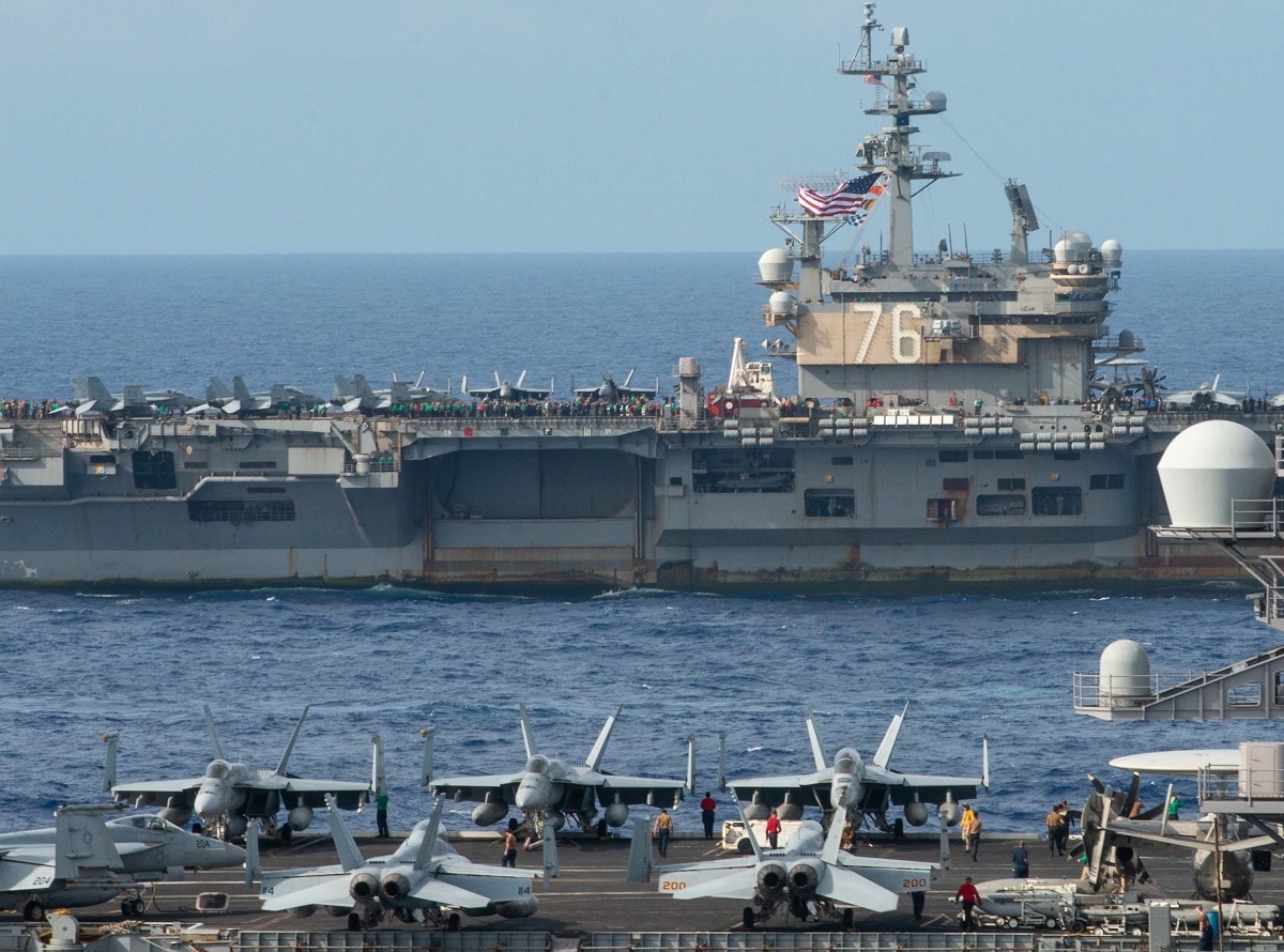 PHILIPPINE SEA (Oct. 3, 2021) The U.S. Navy Nimitz-class aircraft carriers USS Carl Vinson (CVN 70) and USS Ronald Reagan (CVN 76) transit the Philippine Sea during a photo exercise with multiple carrier strike groups, Oct. 3, 2021. The integrated at-sea operations brought together more than 15,000 Sailors across six nations, and demonstrates the U.S. Navy’s ability to work closely with its unmatched network of alliances and partnerships in support of a free and open Indo-Pacific. (U.S. Navy photo by Mass Communication Specialist 2nd Class Michael B. Jarmiolowski) 211003-N-LI114-1208.