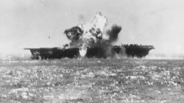 A kamikaze aircraft explodes after crashing into Essex's flight deck amidships 25 November 1944. Image Credit: Creative Commons.