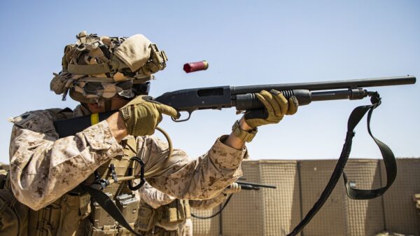 U.S. Marines with 2nd Battalion, 5th Marine Regiment, assigned to Special Purpose Marine-Air Ground Task Force - Crisis Response - Central Command 20.2, fires a Mossberg 590A1 12-gauge shotgun during a combat marksmanship range in Kuwait, June 26, 2020. The combat marksmanship program is designed to improve the Marines accuracy and lethality with their service weapons. The SPMAGTF-CR-CC is a crisis response force, prepared to deploy a variety of capabilities across the region. (U.S. Marine Corps photo by Sgt. Brendan Custer)