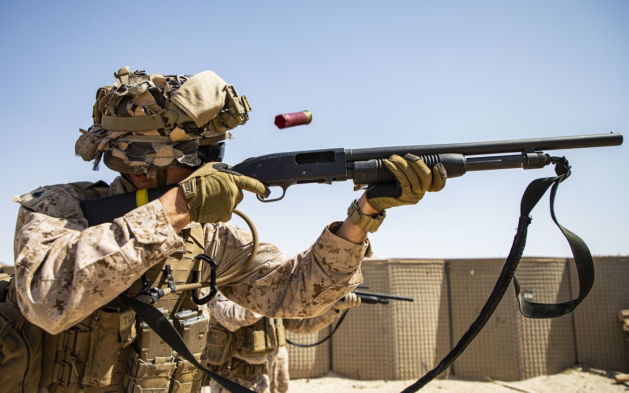 U.S. Marines with 2nd Battalion, 5th Marine Regiment, assigned to Special Purpose Marine-Air Ground Task Force - Crisis Response - Central Command 20.2, fires a Mossberg 590A1 12-gauge shotgun during a combat marksmanship range in Kuwait, June 26, 2020. The combat marksmanship program is designed to improve the Marines accuracy and lethality with their service weapons. The SPMAGTF-CR-CC is a crisis response force, prepared to deploy a variety of capabilities across the region. (U.S. Marine Corps photo by Sgt. Brendan Custer)