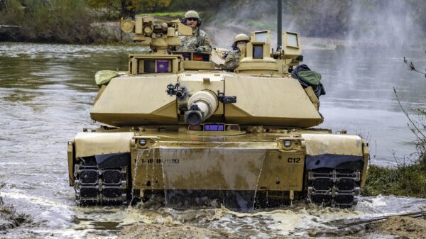 A U.S. Army M1 Abrams tank crew with Charlie Company “Bandidos,” 1st Battalion, 16th Infantry Regiment, 1st Armored Brigade Combat Team, 1st Infantry Division successfully crosses the Nestos River during wet-gap crossing operations as part of Olympic Cooperation 2021 in Xanthi, Greece, Nov. 8, 2021. Olympic Cooperation allows participating forces to conduct rigorous training in realistic training environments with NATO allies and partners to ensure they are ready and lethal. (U.S. Army photo by Cpl. Max Elliott/RELEASED)