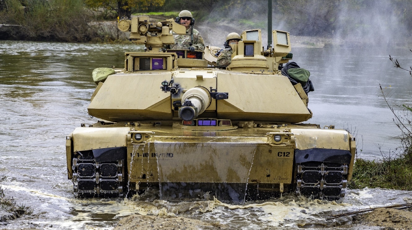 A U.S. Army M1 Abrams tank crew with Charlie Company “Bandidos,” 1st Battalion, 16th Infantry Regiment, 1st Armored Brigade Combat Team, 1st Infantry Division successfully crosses the Nestos River during wet-gap crossing operations as part of Olympic Cooperation 2021 in Xanthi, Greece, Nov. 8, 2021. Olympic Cooperation allows participating forces to conduct rigorous training in realistic training environments with NATO allies and partners to ensure they are ready and lethal. (U.S. Army photo by Cpl. Max Elliott/RELEASED)