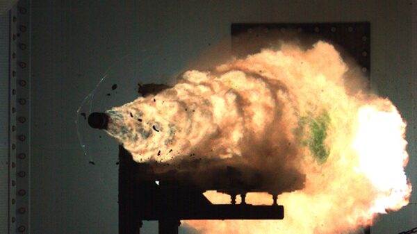 080131-N-0000X-001 DAHLGREN, Va. (Jan. 31, 2008) Photograph taken from a high-speed video camera during a record-setting firing of an electromagnetic railgun (EMRG) at Naval Surface Warfare Center, Dahlgren, Va., on January 31, 2008, firing at 10.64MJ (megajoules) with a muzzle velocity of 2520 meters per second. The Office of Naval ResearchÕs EMRG program is part of the Department of the NavyÕs Science and Technology investments, focused on developing new technologies to support Navy and Marine Corps war fighting needs. This photograph is a frame taken from a high-speed video camera. U.S. Navy Photograph (Released)
