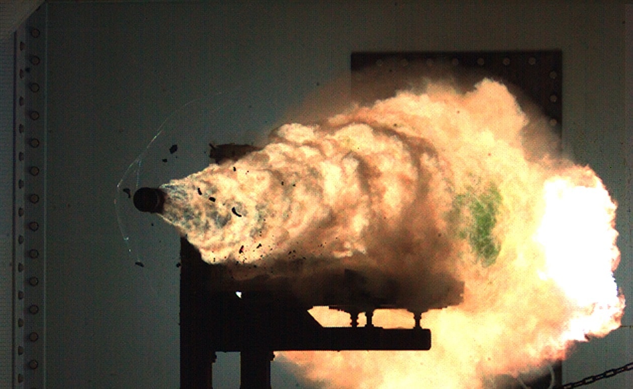 080131-N-0000X-001 DAHLGREN, Va. (Jan. 31, 2008) Photograph taken from a high-speed video camera during a record-setting firing of an electromagnetic railgun (EMRG) at Naval Surface Warfare Center, Dahlgren, Va., on January 31, 2008, firing at 10.64MJ (megajoules) with a muzzle velocity of 2520 meters per second. The Office of Naval ResearchÕs EMRG program is part of the Department of the NavyÕs Science and Technology investments, focused on developing new technologies to support Navy and Marine Corps war fighting needs. This photograph is a frame taken from a high-speed video camera. U.S. Navy Photograph (Released)