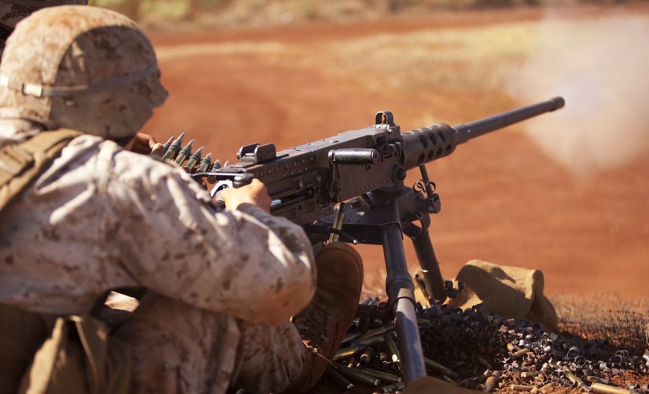 Pfc. Daniel Stillwell, a machine gunner with Charlie Company, 1st Battalion, 3rd Marine Regiment, shoots the .50 caliber M2 Browning machine gun during crew-served weapons training at Schofield Barracks, Oct. 8 to Oct. 10. Image: Creative Commons.