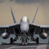 A (Feb. 5, 2021) An F/A-18E Super Hornet, from the "Kestrels" of Strike Fighter Squadron (VFA) 137, rests on the flight deck of the aircraft carrier USS Nimitz (CVN 68) during a strait transit. Nimitz is part of the Nimitz Carrier Strike Group and is deployed conducting maritime security operations and theater security cooperation efforts. (U.S. Navy photo by Mass Communication Specialist 3rd Class Elliot Schaudt/Released)