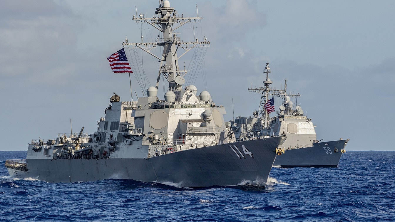 PHILIPPINE SEA (June 23, 2020) The Arleigh Burke-class guided-missile destroyer USS Ralph Johnson (DDG 114) and the Ticonderoga-class guided-missile cruiser USS Princeton (CG 59) steam in formation during dual carrier operations with the Nimitz and Theodore Roosevelt Carrier Strike Groups (CSG). Dual carrier operations unify the tactical power of two individual CSG, providing fleet commanders with an unmatched, unified credible combat force capable of operating indefinitely. The CSGs are on a scheduled deployments to the Indo-Pacific.