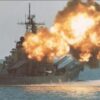 USS Iowa battleship firing its 16-inch guns.