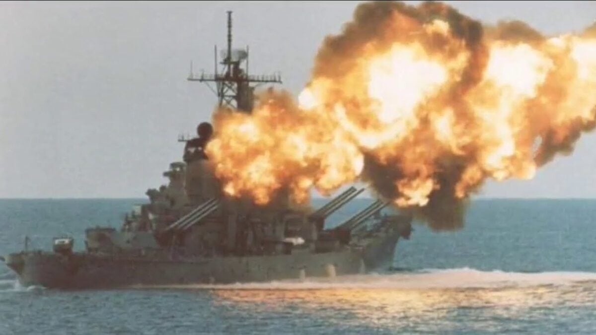 USS Iowa battleship firing its 16-inch guns. 