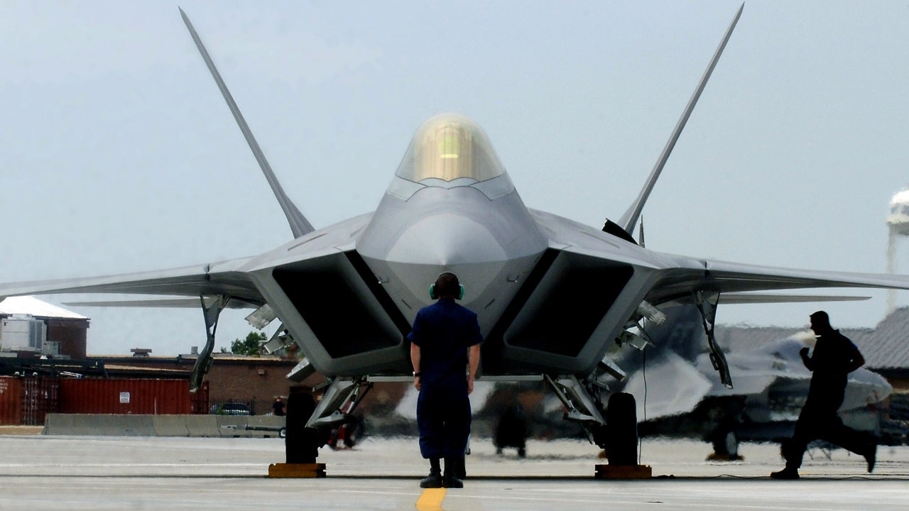 F-22 A Raptor Demonstration Team aircraft maintainers prepare to launch out Maj. Paul "Max" Moga, the first F-22A Raptor demonstration team pilot, July 13. (U.S. Air Force photo/Senior Airman Christopher L. Ingersoll)