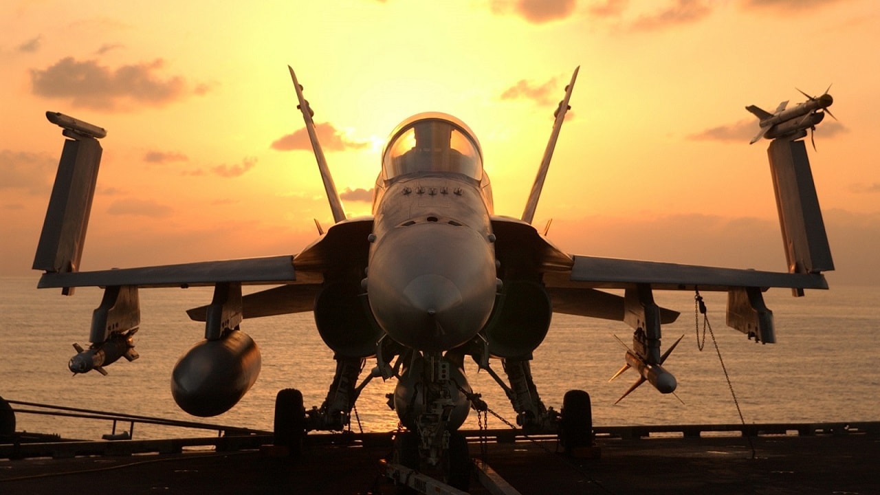 At sea aboard USS John C. Stennis, December 18, 2001 - After an early morning round of flight operations, an F/A-18 Hornet awaits the next round of combat flight operations aboard the USS John C. Stennis (CVN 74). Stennis and her embarked Carrier Air Wing Nine (CVW-9) are supporting Operation Enduring Freedom. U.S. Navy photo by Photographer's Mate 3rd Class Jayme Pastoric