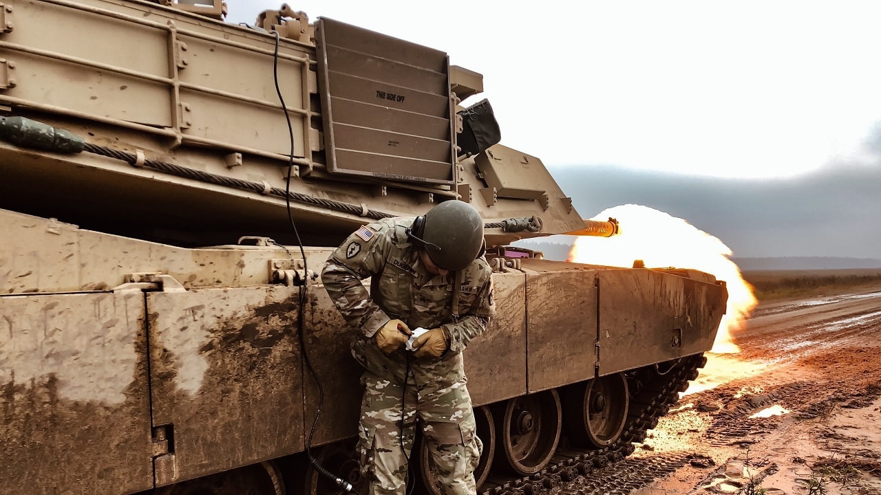 U.S. Army Sgt. Ryan Duginski, M1 Abrams Tank Master Gunner, assigned to Battle Group Poland, performs a tank remote-fire procedure to ensure firing capabilities function properly at Bemowo Piskie Training Area, Poland, Nov. 6. (Photos by U.S. Army 1LT Christina Shoptaw)