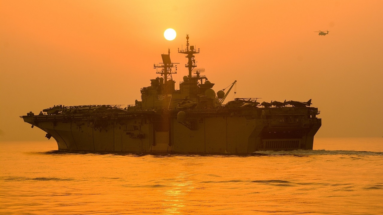 STRAIT OF HORMUZ (Aug. 4, 2021) The Wasp-class amphibious assault ship USS Iwo Jima (LHD 7) transits the Strait of Hormuz, Aug. 4, 2021. Iwo Jima is deployed to the U.S. 5th Fleet area of operations to ensure maritime stability and security in the Central Region, connecting the Mediterranean and the Pacific through the western Indian Ocean and three strategic choke points. (U.S. Navy photo by Seaman Logan Kaczmarek)