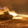 Soldiers fire a 25mm tracer round from an M2A3 fighting vehicle during an integrated night live-fire exercise at Camp Adazi, Latvia, Nov. 25, 2021. Image Creative Commons.