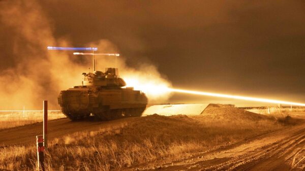 Soldiers fire a 25mm tracer round from an M2A3 fighting vehicle during an integrated night live-fire exercise at Camp Adazi, Latvia, Nov. 25, 2021. Image Creative Commons.