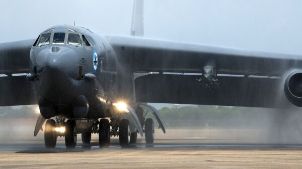 A 2nd Bomb Wing B-52H Stratofortress taxis under a spray of water after returning from a mission July 12, 2014, at Barksdale Air Force Base, La. This marked the last flight for one crew member on the aircraft, Lt. Col. Ronald Polomoscanik, the 343rd Bomb Squadron director of operations, who is retiring after 23 years of service. (U.S. Air Force photo by Master Sgt. Greg Steele/Released)