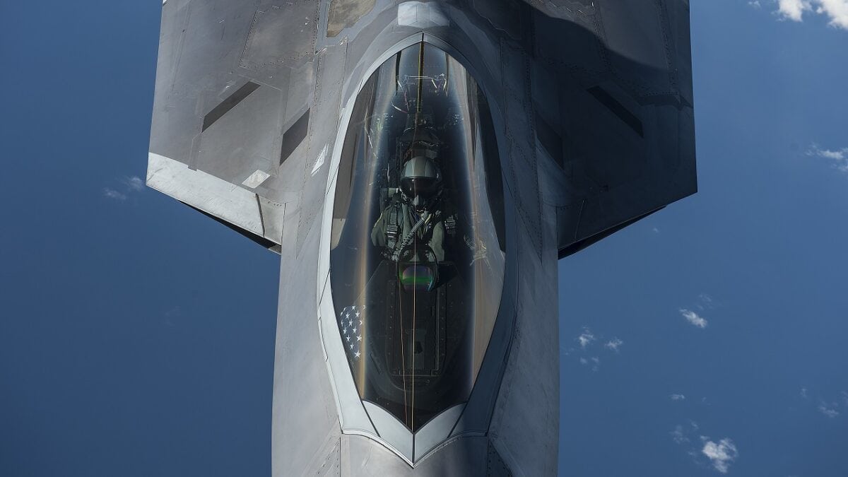 A U.S. Air Force F-22 Raptor pilot from the 95th Fighter Squadron, Tyndall Air Force Base, Fla., flies over the Baltic Sea Sept. 4, 2015. The U.S. Air Force has deployed four F-22 Raptors, one C-17 Globemaster III, approximately 60 Airmen and associated equipment to Spangdahlem Air Base, Germany. While these aircraft and Airmen are in Europe, they will conduct air training with other Europe-based aircraft. (U.S. Air Force photo by Tech. Sgt. Jason Robertson/Released)