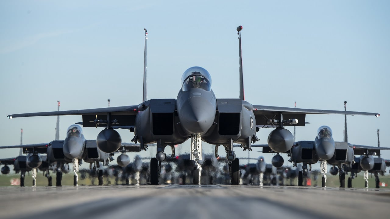 F-15E Strike Eagles taxi into formation June 12, 2019, at Mountain Home Air Force Base, Idaho. This was a rare opportunity to capture the Gunfighter family, including the 391st, 389th and 428th Fighter Squadrons, before a morning flight. (U.S. Air Force photo by Staff Sergeant Jeremy L. Mosier)