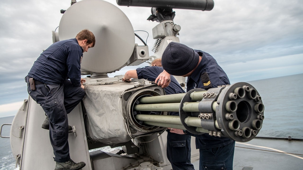 Image: Creative Commons. Crew members aboard Standing NATO Maritime Group Two (SNMG2) flagship HNLMS De Ruyter inspect their Goalkeeper Close in Weapons System (CIWS) before a gunnery exercise as part of NATO exercise Trident Juncture 2018 on October 31, 2018. The Goalkeeper system is for short-range defence of ships against highly maneuverable missiles, aircraft and fast maneuvering surface vessels. Trident Juncture 18 is designed to ensure that NATO forces are trained, able to operate together and ready to respond to any threat from any direction. Trident Juncture 18 takes place in Norway and the surrounding areas of the North Atlantic and the Baltic Sea, including Iceland and the airspace of Finland and Sweden. With around 50,000 participants from 31 nations Trident Juncture 2018 is one of NATOâs largest exercises in recent years. More than 250 aircraft, 65 ships and 10,000 vehicles are involved in the exercise to perform and conduct air, land, maritime, special operation and amphibious drills.