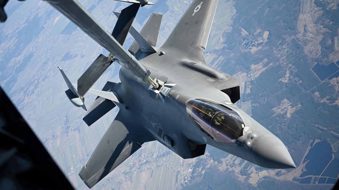 A U.S. Air Force F-35 Lightning II aircraft assigned to the 34th Fighter Squadron receives fuel from a KC-10 Extender aircraft over Poland, February 24, 2022. U.S. Air Force/Senior Airman Joseph Barron/Handout via REUTERS THIS IMAGE HAS BEEN SUPPLIED BY A THIRD PARTY. TPX IMAGES OF THE DAY