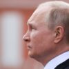 Russian President Vladimir Putin watches a military parade on Victory Day, which marks the 77th anniversary of the victory over Nazi Germany in World War Two, in Red Square in central Moscow, Russia May 9, 2022. Sputnik/Mikhail Metzel/Pool via REUTERS ATTENTION EDITORS - THIS IMAGE WAS PROVIDED BY A THIRD PARTY. THIS PICTURE WAS PROCESSED BY REUTERS TO ENHANCE QUALITY. AN UNPROCESSED VERSION HAS BEEN PROVIDED SEPARATELY.