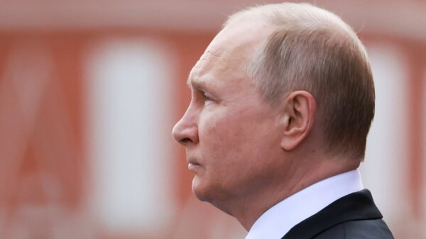 Russian President Vladimir Putin watches a military parade on Victory Day, which marks the 77th anniversary of the victory over Nazi Germany in World War Two, in Red Square in central Moscow, Russia May 9, 2022. Sputnik/Mikhail Metzel/Pool via REUTERS ATTENTION EDITORS - THIS IMAGE WAS PROVIDED BY A THIRD PARTY. THIS PICTURE WAS PROCESSED BY REUTERS TO ENHANCE QUALITY. AN UNPROCESSED VERSION HAS BEEN PROVIDED SEPARATELY.