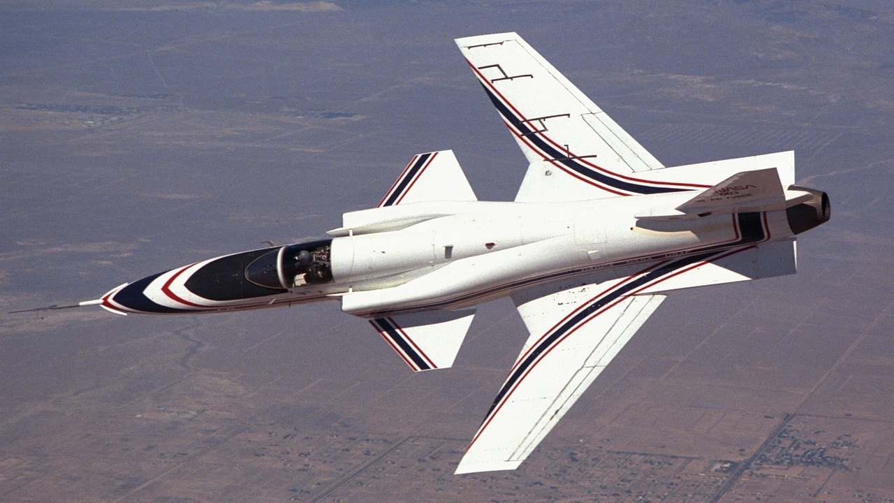 The No. 1 X-29 advanced technology demonstrator aircraft banks over desert terrain near NASA's Ames-Dryden Flight Research Facility (later redesignated the Dryden Flight Research Center), Edwards, California. It was flown in a joint NASA-Air Force-Defense Advanced Research Projects Agency program from December 1984 to 1988 investigating handling qualities, performance, and systems integration on the unique forward-swept-wing research aircraft. Phase 2 of the X-29 program involved aircraft No. 2 and studied the high-angle-of-attack characteristics and military utility of the X-29. Image Credit: Creative Commons.