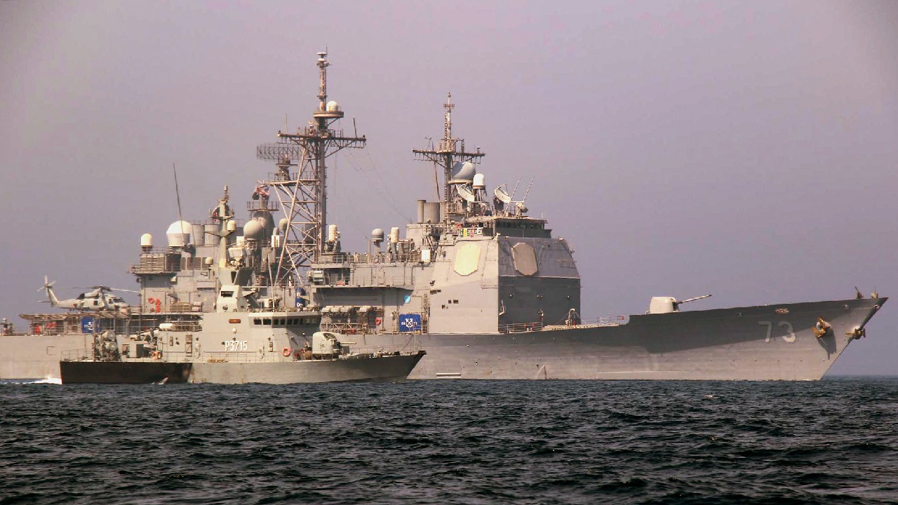ARABIAN GULF (June 8, 2022) The Kuwait navy missile attack craft Failaka (P3715) steams alongside the U.S. Navy guided-missile cruiser USS Port Royal (CG 73) during a passing exercise while operating in the Arabian Gulf, June 7, 2022. Port Royal is deployed to the U.S. 5th Fleet area of operations to help ensure maritime security and stability in the Middle East region. (U.S. Navy photo)