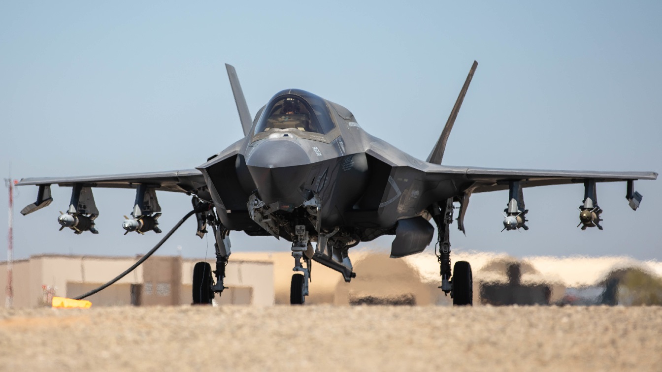 U.S. Marines with Marine Wing Support Squadron 371 , Marine Air Control Group 38, 3rd Marine Aircraft Wing (MAW), refuel a U.S. Marine Corps F-35B Lightning II with Marine Fighter Attack Squadron 225, Marine Aircraft Group (MAG) 13, 3rd MAW, on a Forward Arming and Refueling Point at U.S. Army Yuma Proving Grounds, Yuma, Arizona, May 23, 2022. The weapons configuration consists of six inert guided bombs, four mounted onto the wings and two loaded into the weapons bay, as well as an Air Intercept Missile 9X. Marine Aircraft Group 13 forces are capable of conducting offensive air support, anti-aircraft warfare, and aviation reconnaissance from expeditionary sites in any clime and place. (U.S. Marine Corps photo by Sgt. Samuel Ruiz)