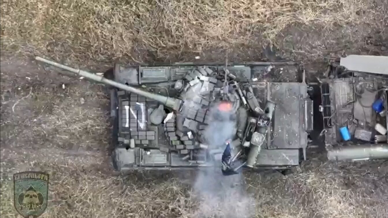 A Russian tank under attack by a drone from Ukraine. Image Credit: YouTube/Ukrainian military.