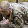 U.S. Army Capt. Valerie Nostrant, assigned to 1st Squadron, 91st Cavalry Regiment, 173rd Airborne Brigade, low crawls under barbed wire during the obstacle course portion of a spur ride at the 7th Army Training Command's Grafenwoehr Training Area, Germany, Dec. 14, 2021. The purpose of this spur ride is to integrate new paratroopers into the Airborne Cavalry and build esprit de corps within the squadron, focused on Cavalry heritage. (U.S. Army photo by Markus Rauchenberger)