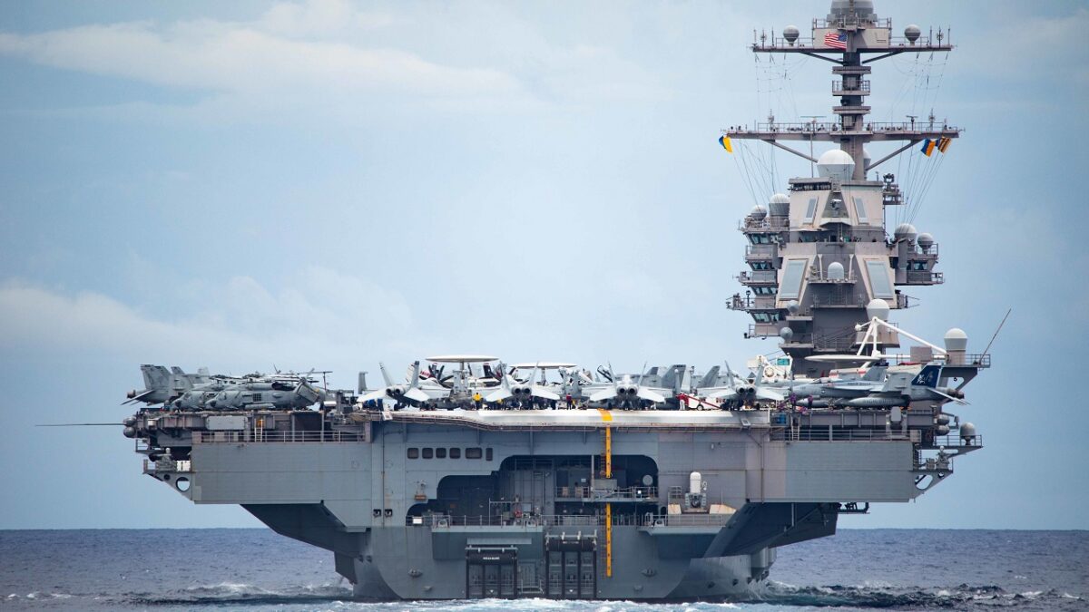 221013-N-LK647-1031 ATLANTIC OCEAN—A view of the first-in-class aircraft carrier USS Gerald R. Ford (CVN 78) from aboard the Ticonderoga-class guided-missile cruiser USS Normandy (CG 60) as Normandy participates in a Tactical Force Exercise as part of the Gerald R. Ford Carrier Strike Group, Oct. 13, 2022. Ford is on its inaugural deployment conducting training and operations alongside NATO Allies and partners to enhance integration for future operations and demonstrate the U.S. Navy’s commitment to a peaceful, stable and conflict-free Atlantic region. (U.S. Navy photo by Mass Communication Specialist 2nd Class Malachi Lakey)