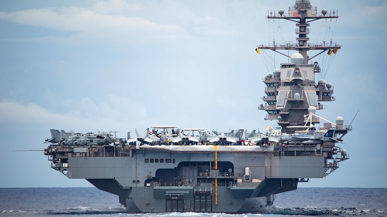 221013-N-LK647-1031 ATLANTIC OCEAN—A view of the first-in-class aircraft carrier USS Gerald R. Ford (CVN 78) from aboard the Ticonderoga-class guided-missile cruiser USS Normandy (CG 60) as Normandy participates in a Tactical Force Exercise as part of the Gerald R. Ford Carrier Strike Group, Oct. 13, 2022. Ford is on its inaugural deployment conducting training and operations alongside NATO Allies and partners to enhance integration for future operations and demonstrate the U.S. Navy’s commitment to a peaceful, stable and conflict-free Atlantic region. (U.S. Navy photo by Mass Communication Specialist 2nd Class Malachi Lakey)