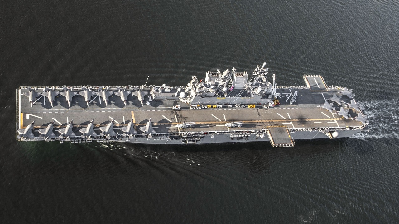 Amphibious assault ship USS Tripoli (LHA- 7) , departs Naval Air Station North Island, Calif., April 7, 2022. Tripoli completed flight deck operations with 20 F-35B Lightning II jets from Marine Fighter Attack Squadrons 211 and 225, Marine Aircraft Group 13, and 3rd Marine Aircraft Wing, as well as Marine Operational Test and Evaluation Squadron 1, as part of the U.S. Marine Corps’ Lightning carrier concept demonstration. The Lightning carrier concept demonstration shows Tripoli and other amphibious assault ships are capable of operating as dedicated fixed-wing strike platforms when needed, capable of bringing fifth generation Short Takeoff/Vertical Landing aircraft wherever they are required. (U.S. Marine Corps photo by Sgt. Samuel Ruiz)