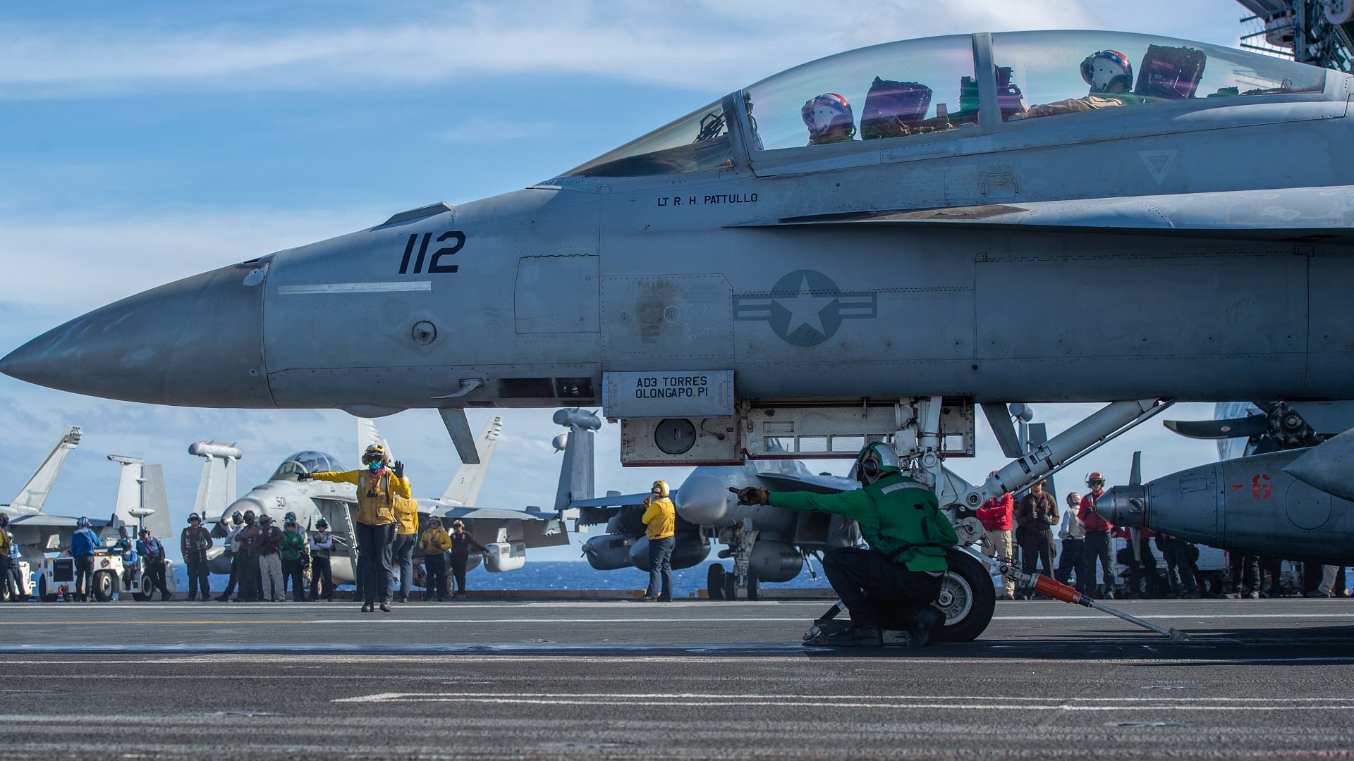 221227-N-DU622-1227 PHILIPPINE SEA (Dec. 27, 2022) An F/A-18F Super Hornet from the “Fighting Redcocks” of Strike Fighter Squadron (VFA) 22 prepares to launch from the flight deck of the aircraft carrier USS Nimitz (CVN 68). Nimitz is in 7th fleet conducting routine operations. 7th Fleet is the U.S. Navy's largest forward-deployed numbered fleet, and routinely interacts and operates with 35 maritime nations in preserving a free and open Indo-Pacific region. (U.S. Navy photo by Mass Communication Specialist 2nd Class Justin McTaggart)