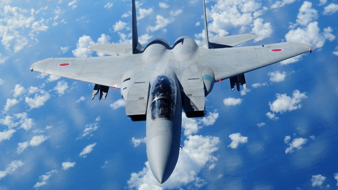 A Japan Air Self Defense Force F-15 (F-15DJ) in flight, as viewed from the boom operator position of a U.S. Air Force KC-135 from the 909th Air Refueling Squadron, Kadena Air Base, after being refueled during air refueling training July 30, 2009.