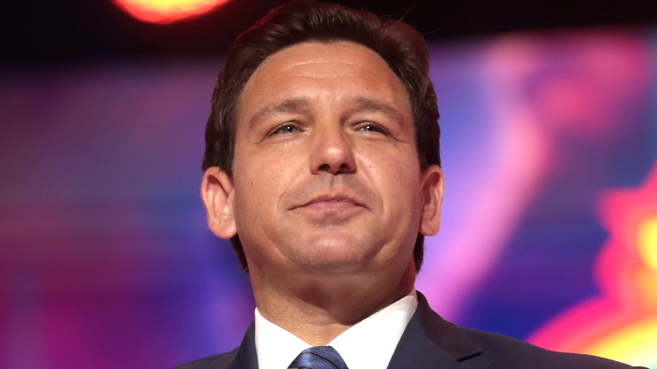 By Gage Skidmore: Governor Ron DeSantis speaking with attendees at the 2022 Student Action Summit at the Tampa Convention Center in Tampa, Florida. Photo by Gage Skidmore.