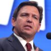 Governor Ron DeSantis speaking with attendees at a "Unite & Win Rally" at Arizona Financial Theatre in Phoenix, Arizona. Image Credit: Gage Skidmore.