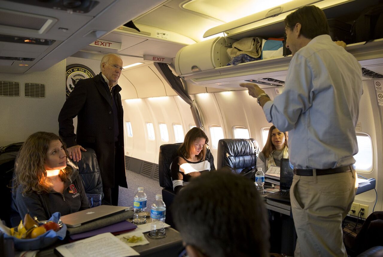 Joe Biden on Air Force Two with aides en route to Ukraine.