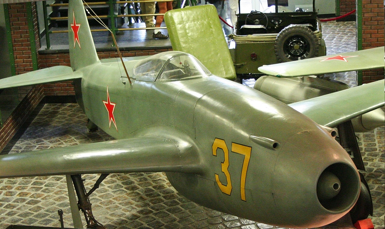 Image Credit: Creative Commons. The Yak-15 was essentially a Yak-3 airframe fitted with a copy of the Junkers Jumo 004 jet engine. It was one of only two aircraft types to be successfully converted from piston to jet power, the other being the Saab J-21, The NATO codename for the type was 'Feather'. 280 were built and this is the only known survivor. It's msn has been suggested as being '31007', but this is unconfirmed. Displayed at the Vadim Zadorozhny Technical Museum, Arkhangelskoye, Moscow. Russia. 14-8-2012
