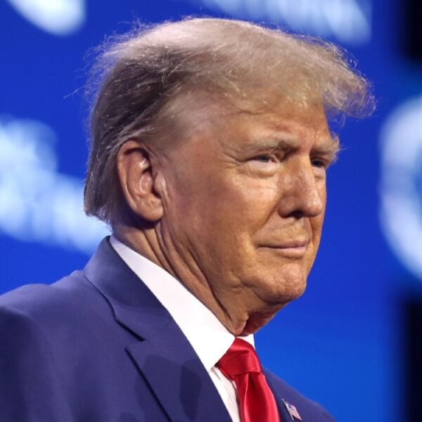 Former President of the United States Donald Trump speaking with attendees at the 2023 Turning Point Action Conference at the Palm Beach County Convention Center in West Palm Beach, Florida.