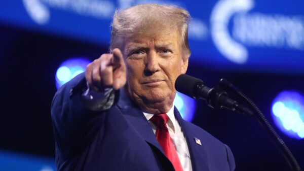 Former President of the United States Donald Trump speaking with attendees at the 2023 Turning Point Action Conference at the Palm Beach County Convention Center in West Palm Beach, Florida. By Gage Skidmore.