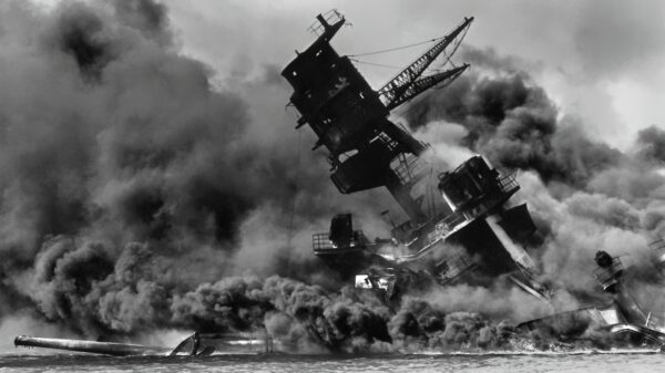 The USS Arizona (BB-39) burning after the Japanese attack on Pearl Harbor, 7 December 1941.