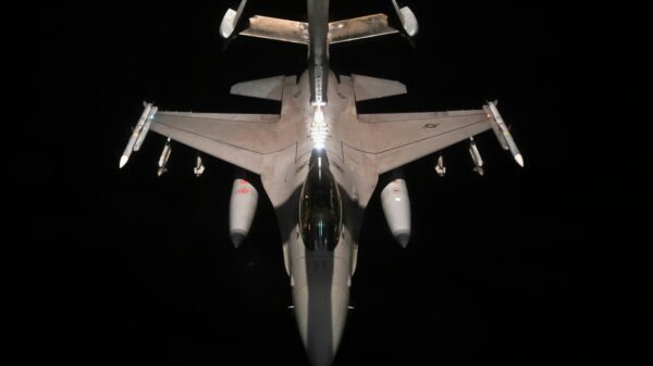 A U.S. Air Force F-16 Fighting Falcon assigned to the 77th Expeditionary Fighter Squadron, receives fuel from a KC-10 Extender assigned to the 908th Expeditionary Air Refueling Squadron, over an undisclosed location within the U.S. Central Command area of responsibility, Dec. 2, 2022. F-16 aircraft routinely conduct presence patrols within the CENTCOM AOR to reassure allies and ensure regional security. (U.S. Air Force photo by Staff Sgt. Gerald R. Willis)